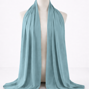 Elegant-mannequin-with-teal-fabric-drape.png
